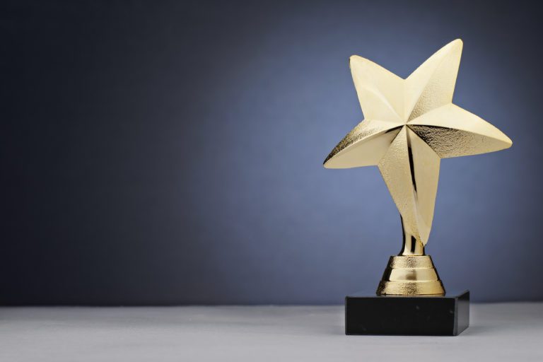 Shiny gold trophy in the shape of a star