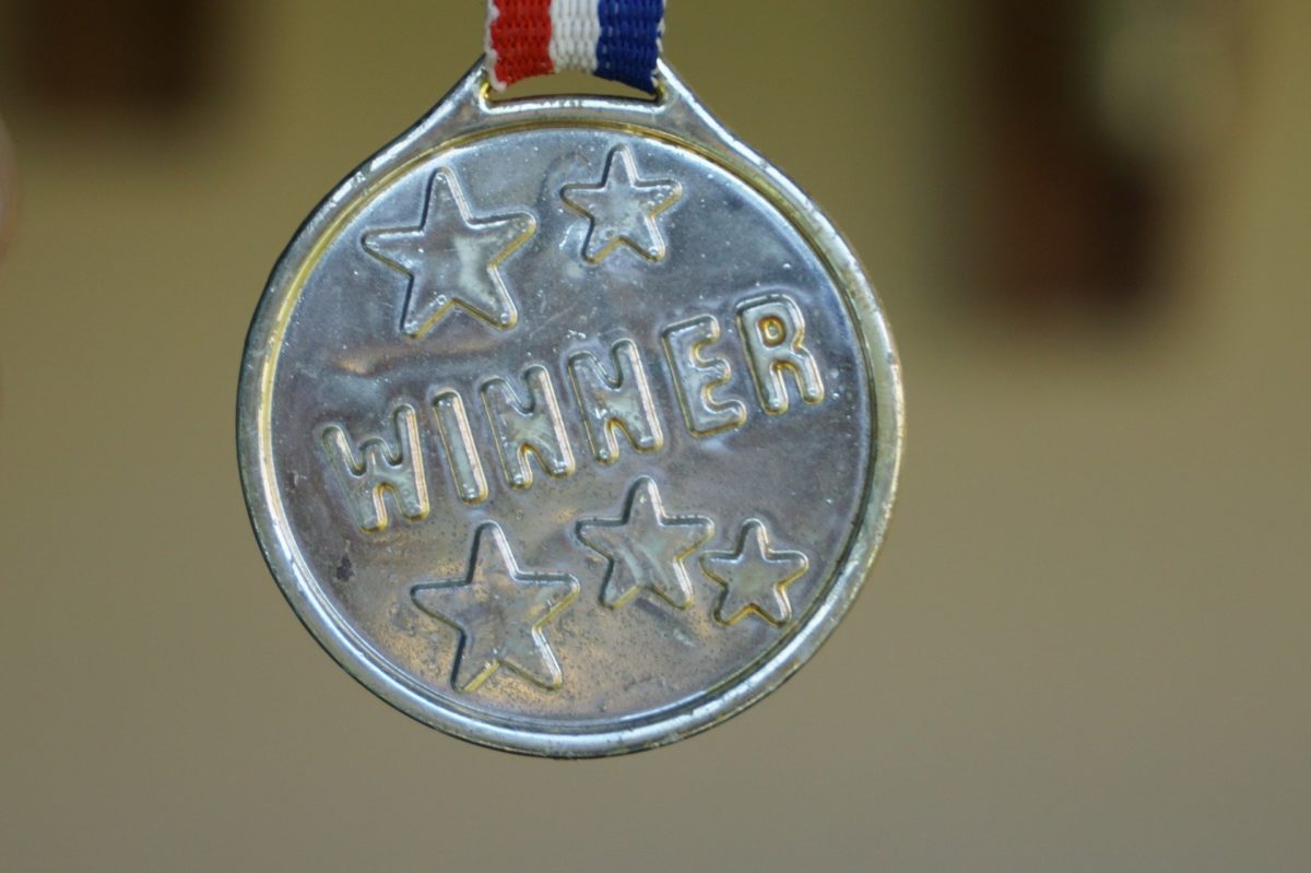 Close up photo of medal with 'Winner' embossed on it