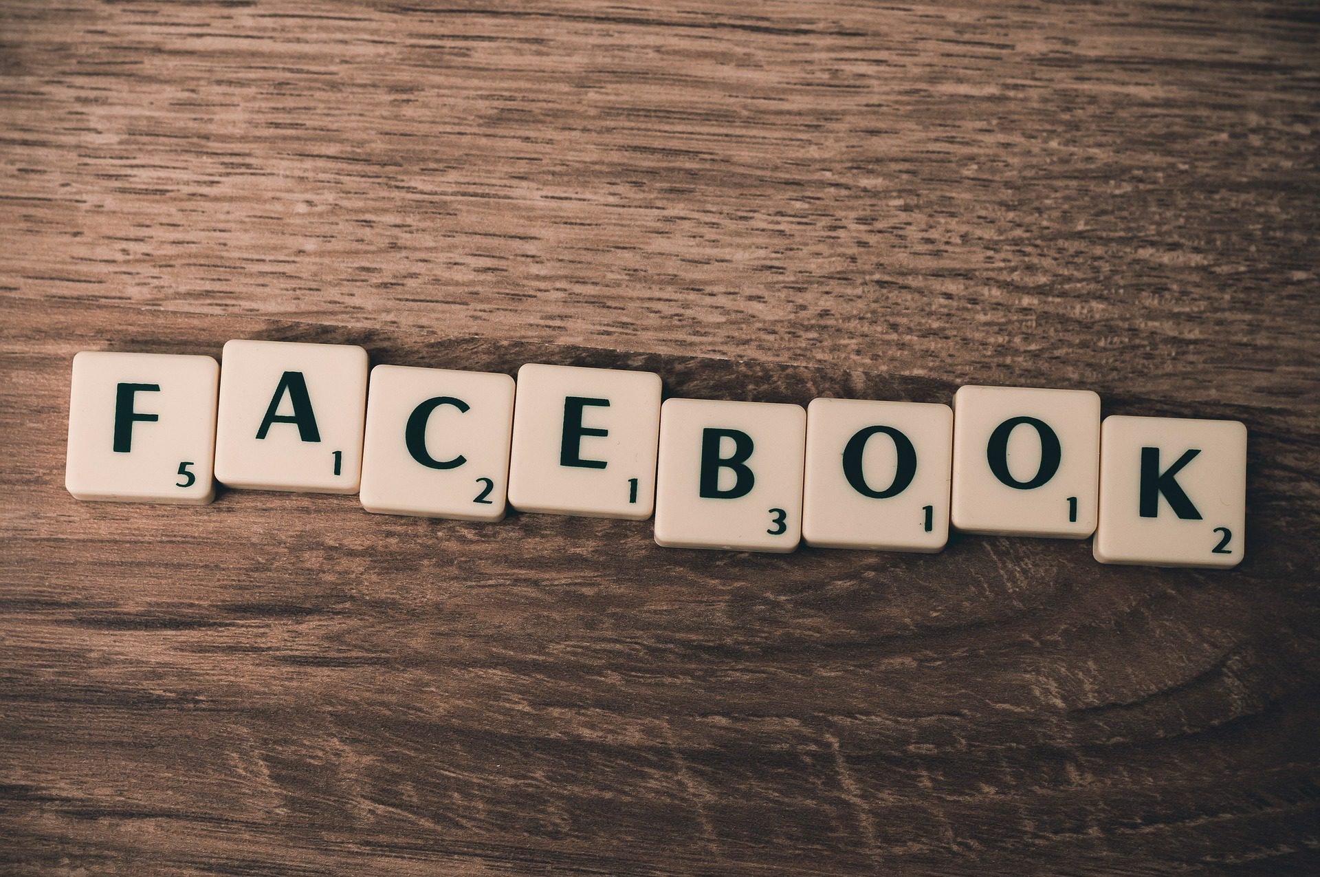 Scrabble tiles forming the word 'Facebook'