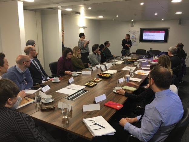 Photo of roundtable event in meeting room