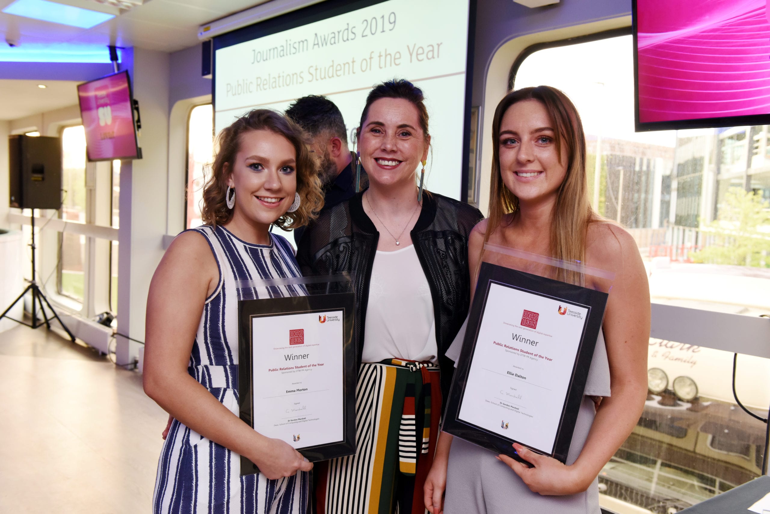 photograph of Lorna with students presenting awards